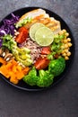 Buddha bowl dish with chicken fillet, brown rice, avocado, pepper, tomato, broccoli, red cabbage, chickpea, fresh lettuce salad, p Royalty Free Stock Photo