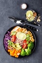 Buddha bowl dish with chicken fillet, brown rice, avocado, pepper, tomato, broccoli, red cabbage, chickpea, fresh lettuce salad, p Royalty Free Stock Photo