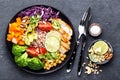 Buddha bowl dish with chicken fillet, brown rice, avocado, pepper, tomato, broccoli, red cabbage, chickpea, fresh lettuce salad, p Royalty Free Stock Photo