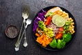 Buddha bowl dish with chicken fillet, brown rice, avocado, pepper, tomato, broccoli, red cabbage, chickpea, fresh lettuce salad, p Royalty Free Stock Photo