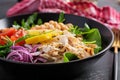 Buddha bowl dish with chicken fillet, chickpeas, tomatoes, red onion, fresh green salad and seed sesame. Royalty Free Stock Photo