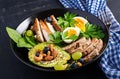 Buddha bowl dish with meatloaf, chicken meat, avocado, berries and nuts. Detox and healthy concept.
