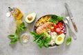 Buddha bowl with grilled chicken breast, tomato, onion, corn, avocado, fresh basil salad and rice, healthy balanced eating Royalty Free Stock Photo