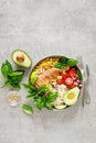 Buddha bowl with grilled chicken breast, tomato, onion, corn, avocado, fresh basil salad and rice, healthy balanced eating Royalty Free Stock Photo