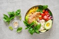 Buddha bowl with grilled chicken breast, tomato, onion, corn, avocado, fresh basil salad and rice, healthy balanced eating Royalty Free Stock Photo