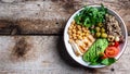 Buddha bowl with kale salad, quinoa, chicken fillet, chickpeas, avocado, spinach, tomatoes cherries, nuts arugula, Clean eating, Royalty Free Stock Photo