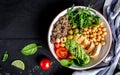 Buddha bowl with kale salad, quinoa, chicken fillet, chickpeas, avocado, spinach, tomatoes cherries, nuts arugula, Clean eating, Royalty Free Stock Photo