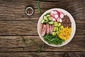 Buddha bowl lunch with grilled beef steak and quinoa, corn, avocado, cucumber Royalty Free Stock Photo