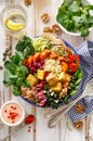 Buddha bowl of mixed vegetables,tofu cheese and groats. Healthy and nutritious vegan meal.