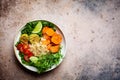 Buddha bowl with quinoa salad, baked sweet potato, falafel, kale and pea seedlings. Healthy falafel salad bowl, copy space, top Royalty Free Stock Photo