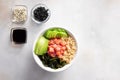 Buddha bowl with quinoa, salmon, wakame seaweed, avocado and cucumber. Diet food. Royalty Free Stock Photo