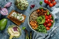 Buddha bowl salad with baked sweet potatoes, chickpeas, quinoa, tomatoes, arugula, avocado, sprouts on light blue background with Royalty Free Stock Photo