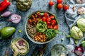 Buddha bowl salad with baked sweet potatoes, chickpeas, quinoa, tomatoes, arugula, avocado, sprouts on light blue background with Royalty Free Stock Photo