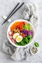 Buddha bowl salad with chickpeas, sweet pepper, tomato, cucumber, red cabbage kale, fresh radish, spinach leaves and boiled egg Royalty Free Stock Photo