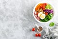 Buddha bowl salad with chickpeas, sweet pepper, tomato, cucumber, red cabbage kale, fresh radish, spinach leaves and boiled egg Royalty Free Stock Photo