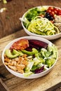 Buddha bowl salads on a wooden table