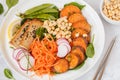 Buddha bowl with vegetables, tofu, baked sweet potato, sprouts c Royalty Free Stock Photo