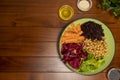 Buddha bowl on wooden table. Vegetarian and vegan food. Royalty Free Stock Photo