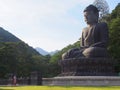 Buddha bronze statue and monk, Sinheungsa temple, South Korea