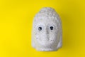 Buddha ceramic head with googly eyes