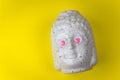 Buddha ceramic head with googly eyes