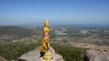 Buddha on cliff of Khao Phraya Doen Thong mountain at Phatthana Nikhom city in Lop Buri, Thailand