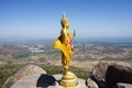 Buddha on cliff of Khao Phraya Doen Thong mountain for thai people travelers travel visit trail trekking go to respect praying Royalty Free Stock Photo