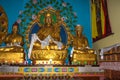 Buddha disciple golden statue close up shot at monastery from different perspective