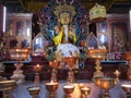 Buddha disciple golden statue close up shot at monastery from different perspective