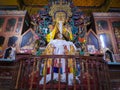 Buddha disciple golden statue close up shot at monastery from different perspective