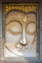 Buddha face sculpture