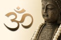 Buddha figure and om symbol