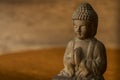 Buddha figure in prayer position Royalty Free Stock Photo