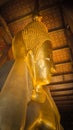 the Buddha gold statue face in the Temple of the Reclining Buddha , Wat Pho, Bangkok, Thailand Royalty Free Stock Photo