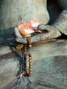 Buddha: hand with mala beads Royalty Free Stock Photo