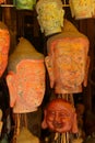 Buddha head masks and carvings Royalty Free Stock Photo