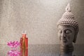 Buddha head statue, incense sticks, orchid flower decoration and copy space for text. Royalty Free Stock Photo