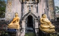 Buddha image in front of the pagoda of Wat Phra Phutthabat Bua Bok Temple that enshrines the legendary Buddha's footprint.