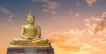 Buddha image and golden sky in the evening