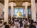 The Buddha image inside Mahabodhi temple of Anuradhapura, Shri Lanka. Devotees are worshipping the Buddha