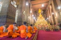 Buddha image and monks in Wat Pho Temple, Bangkok, Thailand Royalty Free Stock Photo