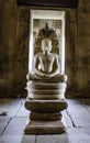 The Buddha image in the posture of Naga Prok carved from sandstone is located in the main prang of Prasat Hin Phimai