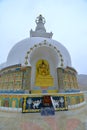 Buddha image on the second level of the Shanti Stupa in Leh, depicting the `turning wheel of Dharma`.
