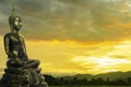 Buddha image inÃ¢â¬â¹      the sunrise over the temple on the hill background in Thailand - Asia Royalty Free Stock Photo