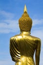 Buddha image turn back with blue sky Royalty Free Stock Photo