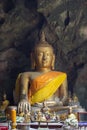 Buddha images in Khao Luang Cave.Non English texts mean the worship words Royalty Free Stock Photo