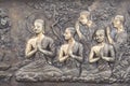 Buddha metal copper carving on temple wall in Thailand.