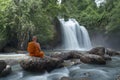 Buddha monk practice meditation at  waterfall Royalty Free Stock Photo