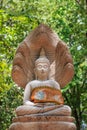 Buddha with a naga over His head n Wat Umong Chiang Mai. Thailand Royalty Free Stock Photo