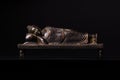 Buddha in parinirvana position - a figure from bronze,. Royalty Free Stock Photo